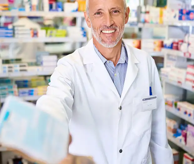 pharmacist handing semaglutide weight loss medication to patient