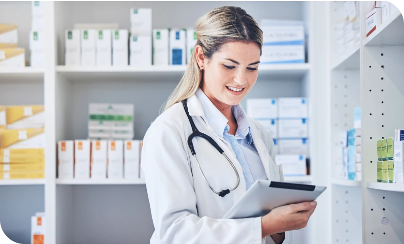 pharmacist reviewing prescription info on tablet pharmacist reviewing prescription info on tablet
